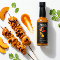 Project Casper peach maple garlic hot sauce bottle with grilled chicken skewers, fresh peach slices and herbs (hover), photo 3