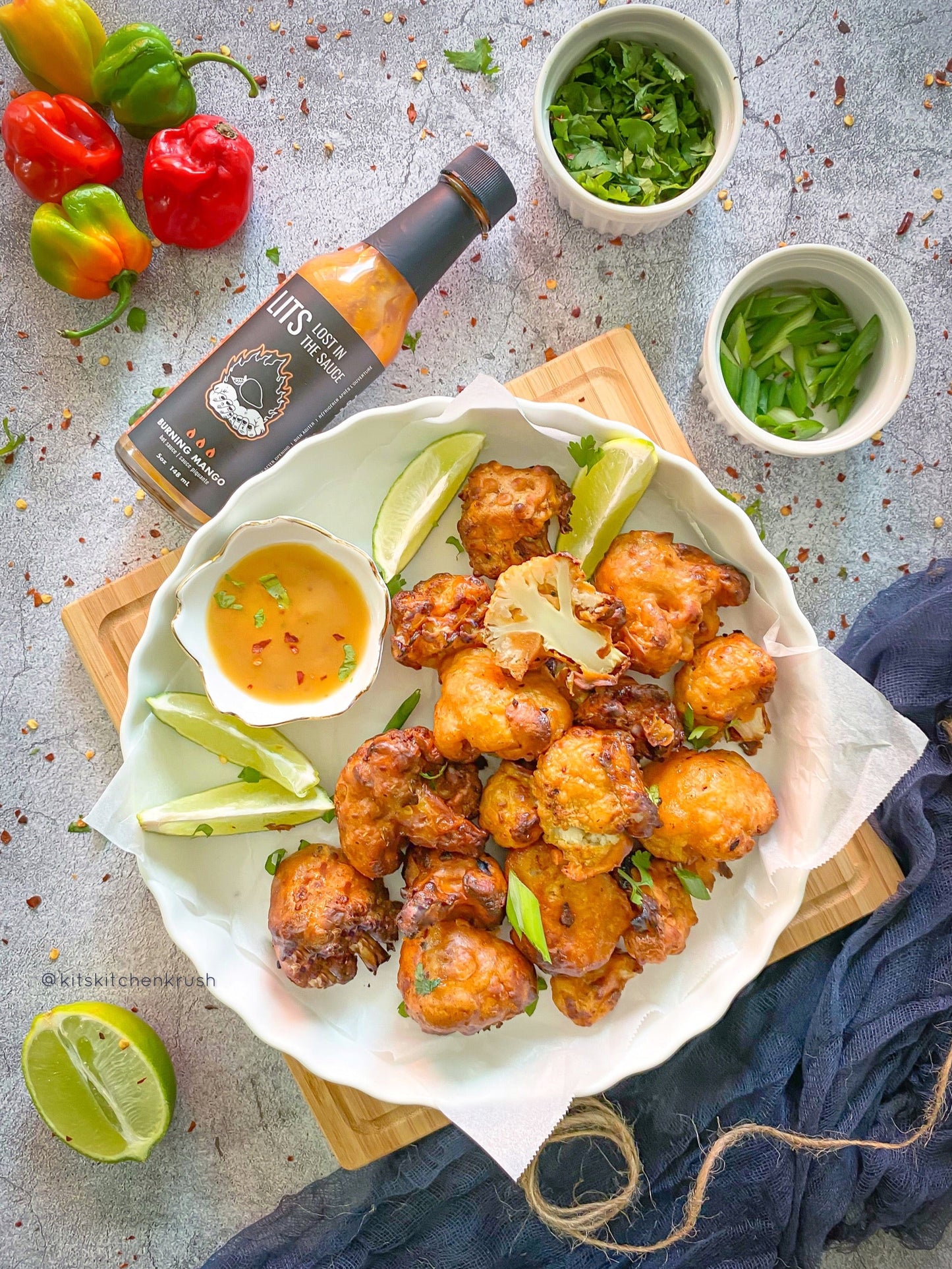 Crispy air-fried cauliflower wings tossed in LITS Burning Mango hot sauce
